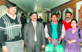 A health team comes out of the Gymkhana Club after collecting food samples in Jalandhar on Wednesday.