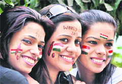 Cricket fans paint their faces ahead of the World Cup, in Patna.