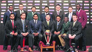 The 14 national captains, ( front row L-R) Canada's Ashish Bagai, Netherlands Peter Borren, Sri Lankas Kumar Sangakkara, Australia's Ricky Ponting, Bangladesh's Shakib Al Hasan, Kenya's Jimmy Kamande and Irelands William Porterfield, (Back Row L-R) Zimbabwe's Elton Chigumbura, New Zealand's Daniel Vettori, Pakistans Shahid Afridi, India's Mahendra Singh Dhoni, South Africa's Graeme Smith, England's Andrew Strauss and West Indies Darren Sammy pose with the ICC Cricket World Cup trophy in Dhaka