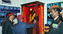 Lieutenant General Sanjiv Chachra unveils the bust of Lance Naik Drigpal Singh in the museum at village Asafawla.