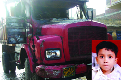 A child (inset) who was crushed by a truck that was later torched by angry residents at Rohini in northwest Delhi