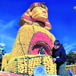 A worker puts final touches to a giant Sphinx made from lemons and oranges during the lemon festival in Menton, France, on Friday.  Reuters