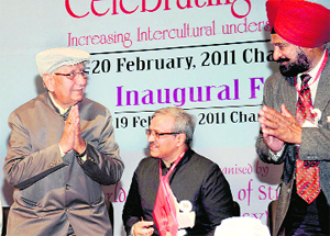 Satpal Gosain (left), senior BJP leader from Punjab, is welcomed by Harvinder Singh Bhaji (right) at an international seminar at Law Bhavan in Chandigarh on Saturday. Tribune photo: Manoj Mahajan