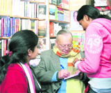 Ruskin Bond signs autographs in Mussoorie on Saturday.