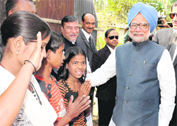 PM Manmohan Singh during his visit to Haligaon-Dokhola in Kamrup, Assam