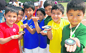 RICH HAUL: Students of Smart Wonders School show their medals at the annual athletics meet in Chandigarh on Sunday.