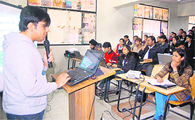 Sunny Vaghela, cyber security expert, gives a presentation in the Dehradun Institute of Technology on Sunday. A Tribune photograph
