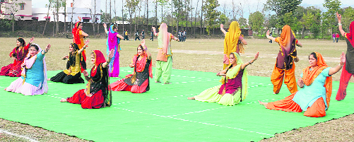 Students perform giddha at the conclusion of the annual sports meet at Balawala, near Dehradun, on Sunday.