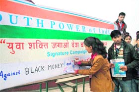 Activists of the Youth Power of India during a signature campaign against corruption in Shimla