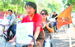 Students from Bhutan take out a cycle rally to mark the birth anniversary of their king in Chandigarh