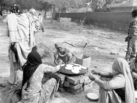 Dalit women from Mirchpur village making chapatis for the protesters in Hisar.