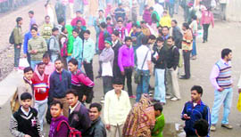 Anxious commuters at the Narela railway station on Monday morning.