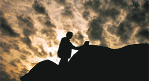 A painter goes about his job on a cloudy evening in Gurgaon.