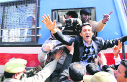 Protesting government employees being detained by the police in Jammu on Monday. 