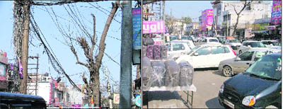 Loose electricity wires pose a threat to commuters; and (right) vehicles parked haphazardly on a road in Ghumar Mandi in Ludhiana.