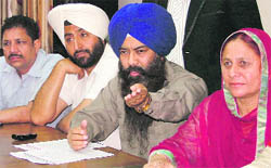 Office-bearers of the Danga Peerit Welfare Society address the media in Ludhiana on Monday. 