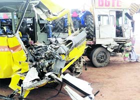 The mangled remains of a bus that was hit by a truck near Kinana village in Jind
