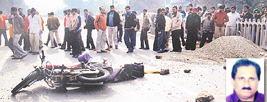 The motorcycle of the deceased (inset) lying at Vishkarma Chowk