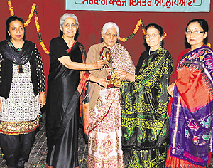 Bhavish Rai Dhanda (centre) being honoured at Government College for Women in Ludhiana on Tuesday. A Tribune photograph