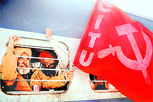 Members of the CPM raise slogans against the Central Government as they sit inside a train in Amritsar on Tuesday. The train was bound for Delhi where CPM activists plan to gather outside Parliament House to protest against price rise.