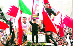 The son of Ridha Mohammed gestures during his fathers funeral in Malkiya, west Manama, on Tuesday