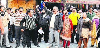 ONE: Shopkeepers protest at the Sector 19 Sadar Bazaar in Chandigarh on Wednesday.