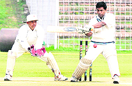 READY TO STRIKE: A player in action during the All-India Inter-Zonal Indian Audit and Accounts Department (IA&AD) Cricket Tournament at the Sector 16 Cricket Stadium in Chandigarh on Wednesday