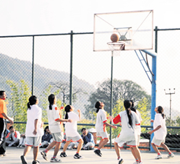 A match in the Inter-House Basketball Tournament under way at Unison World School on Wednesday. A Tribune photograph