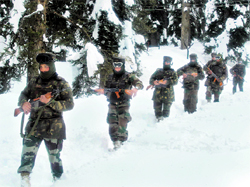 Army personnel patrol the LoC in the snow-covered Gulmarg sector in Kashmir on Wednesday