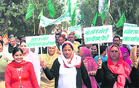 Women activists of the INLD hold a protest against price rise and corruption in Kurukshetra on Thursday.