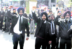 Lawyers block traffic while holding a protest in Amritsar on Thursday