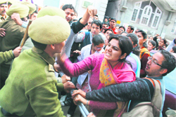Members of the Jammu & Kashmir Physiotherapists Association clash with the police during a protest at Mubarak Mandi in Jammu