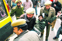 A member of the J&K Agriculture Technocrats Association, who fell unconscious during a fast at Mubarak Mandi in Jammu, being taken to hospital 