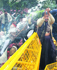 Water cannons being used to disperse BJP activists during a protest against corruption and rising prices, in New Delhi on Thursday