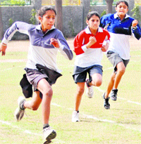 Students participate in an inter-house athletics meet at YPS, Mohali, on Friday
