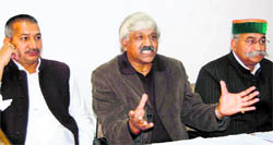 Uttarakhand Congress legislators (left to right) Kishore Upadhaya, Dinesh Agarwal and Jot Singh Gunsola address a press conference in Dehradun on Friday.