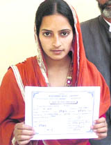 Sabnoor, a newly elected Zila Panchayat member, with her election certificate.