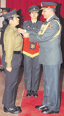 Maj Mitali Madhumita of the Army Education Corps receives the Sena Medal from Lt-Gen SK Singh, GOC-in-Chief, South Western Command, in Hisar on Friday. A Tribune photograph