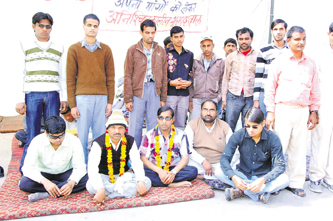 Visually impaired teacher Suresh and Rajesh Kumar sit on indefinite fast in Sirsa on Friday. A Tribune photograph