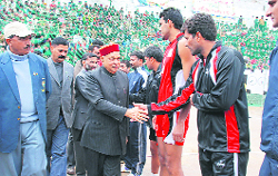 Chief Minister Prem Kumar Dhumal meets the players at Rajgarh