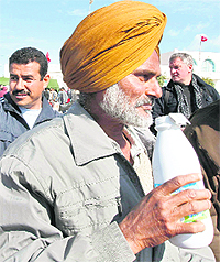 Indians fleeing Libya receive food after they crossed into Tunisia on Friday.