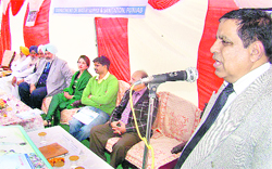 NK Dhir, Programme Director, World Bank, addresses residents of Singhpura village on Friday