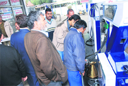 Uttarakhand Food and Civil Supplies Minister Diwakar Bhatt during a raid at a petrol pump in Dehradun