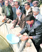 The ICAR chief, Dr S Ayyappan (2nd from right), at Sultan Singh's fish processing unit at Bhutana village in Karnal on Saturday. 