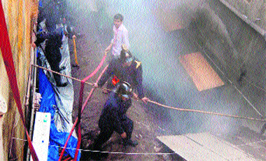 Firemen try to douse flames at a store in Dawoodi Building in Mumbai on Saturday.