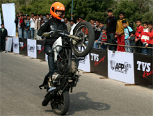 A professional motorcycle stuntman performs on the