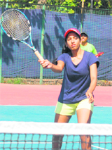 A player of the Madras University in action during the All-India Inter-University Tennis Tournament at Panjab University in Chandigarh on Sunday.