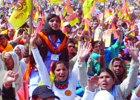 Supporters of yoga guru Baba Ramdev shout slogans during a rally against the balck money and corruption at Ram Lila Grounds in New Delhi