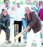 Uttarakhand Cabinet minister Madan Kaushik set to hit a ball in an exhibition match held at Gurukul Kangri Universtiy in Haridwar on Sunday. 