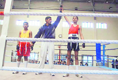 A boxer being declared the winner at the RIMC in Dehradun on Sunday. 